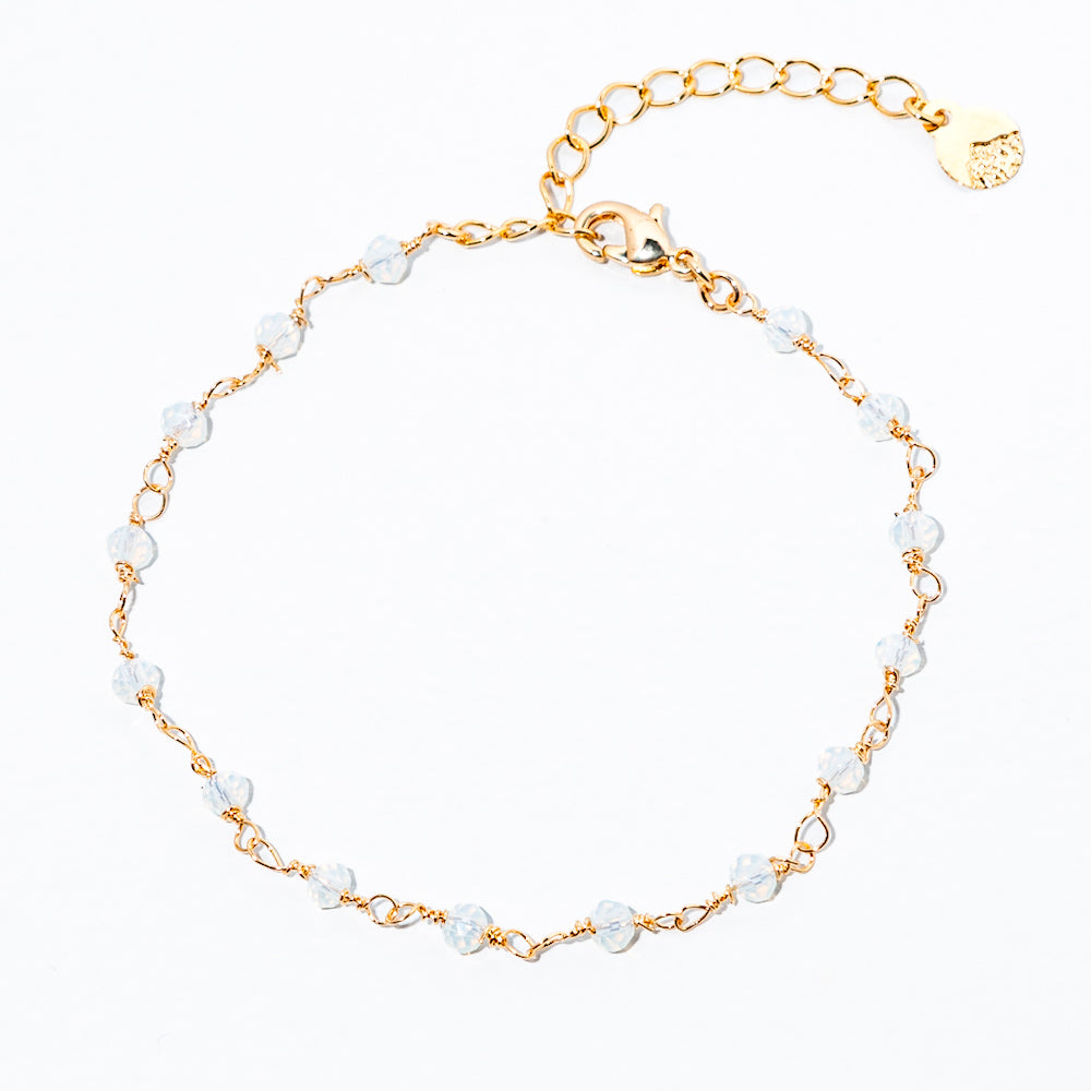 pulseira de cristal branco banhada a ouro 18 k - Reia
